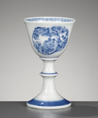 Lot 1221 - A HIRADO BLUE AND WHITE STEM CUP WITH FLORAL ROUNDELS
