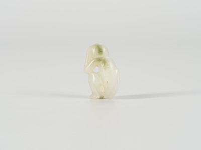 A SMALL JADE FIGURE OF A MONKEY, LATE QING