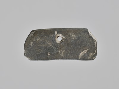 A BLACK STONE AXE BLADE, NEOLITHIC PERIOD