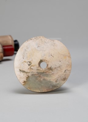 A SMALL ARCHAISTIC JADE BI DISC, NEOLITHIC PERIOD OR LATER