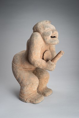 Lot 779 - A HAN-STYLE TERRACOTTA FIGURE OF A SQUATTING DRUMMER