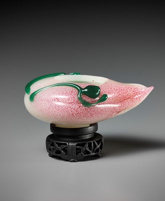 Lot 121 - A GREEN AND PINK OVERLAY GLASS ‘PEACH’ BRUSHWASHER, QING DYNASTY