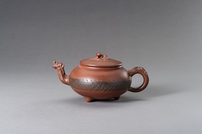Lot 950 - A MOULDED YIXING ZISHA ‘DRAGON’ TEAPOT AND COVER, 20TH CENTURY