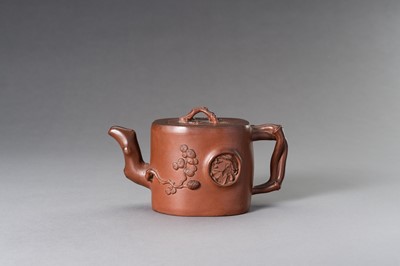 Lot 948 - A MOULDED YIXING ZISHA ‘THREE FRIENDS OF WINTER’ TEAPOT AND COVER, 20TH CENTURY