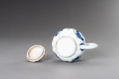 Lot 573 - A BLUE AND WHITE ‘BUTTERFLIES’ TEAPOT, QING