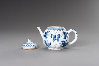 Lot 573 - A BLUE AND WHITE ‘BUTTERFLIES’ TEAPOT, QING