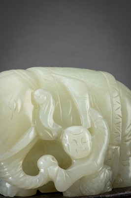 Lot 231 - A PALE CELADON AND RUSSET ‘ELEPHANT AND BOY’ GROUP, 1930s