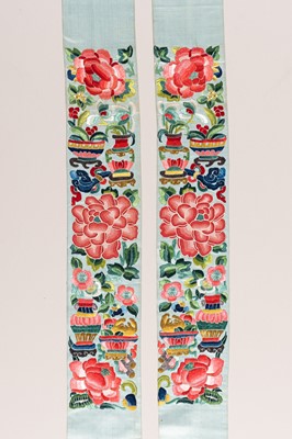 Lot 975 - A PAIR OF PALE TURQUOISE ‘PEONY’ SILK SLEEVE BANDS, LATE QING DYNASTY