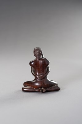 Lot 29 - A ZITAN WOOD FIGURE OF A COUPLE IN EROTIC EMBRACE
