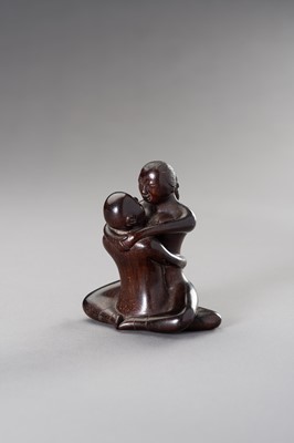 Lot 29 - A ZITAN WOOD FIGURE OF A COUPLE IN EROTIC EMBRACE