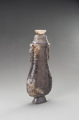 Lot 255 - A LILAC-GRAY JADE ARCHAISTIC VASE AND COVER, HU, 20TH CENTURY