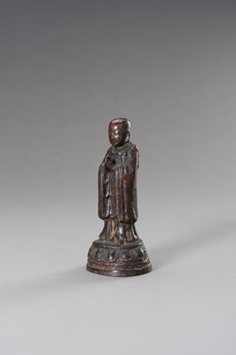 Lot 99 - A MINIATURE BRONZE FIGURE OF A MONK, EARLY QING DYNASTY