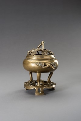 Lot 243 - A `CHERRY BLOSSOMS’ BRONZE TRIPOD CENSER WITH MATCHING STAND, QING DYNASTY