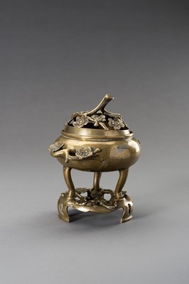 Lot 243 - A `CHERRY BLOSSOMS’ BRONZE TRIPOD CENSER WITH MATCHING STAND, QING DYNASTY