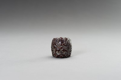 Lot 293 - A CARVED ‘BEAST’ HORN RING, 1900s