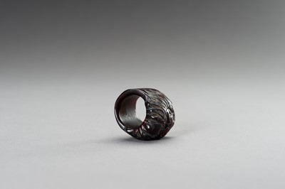 Lot 293 - A CARVED ‘BEAST’ HORN RING, 1900s