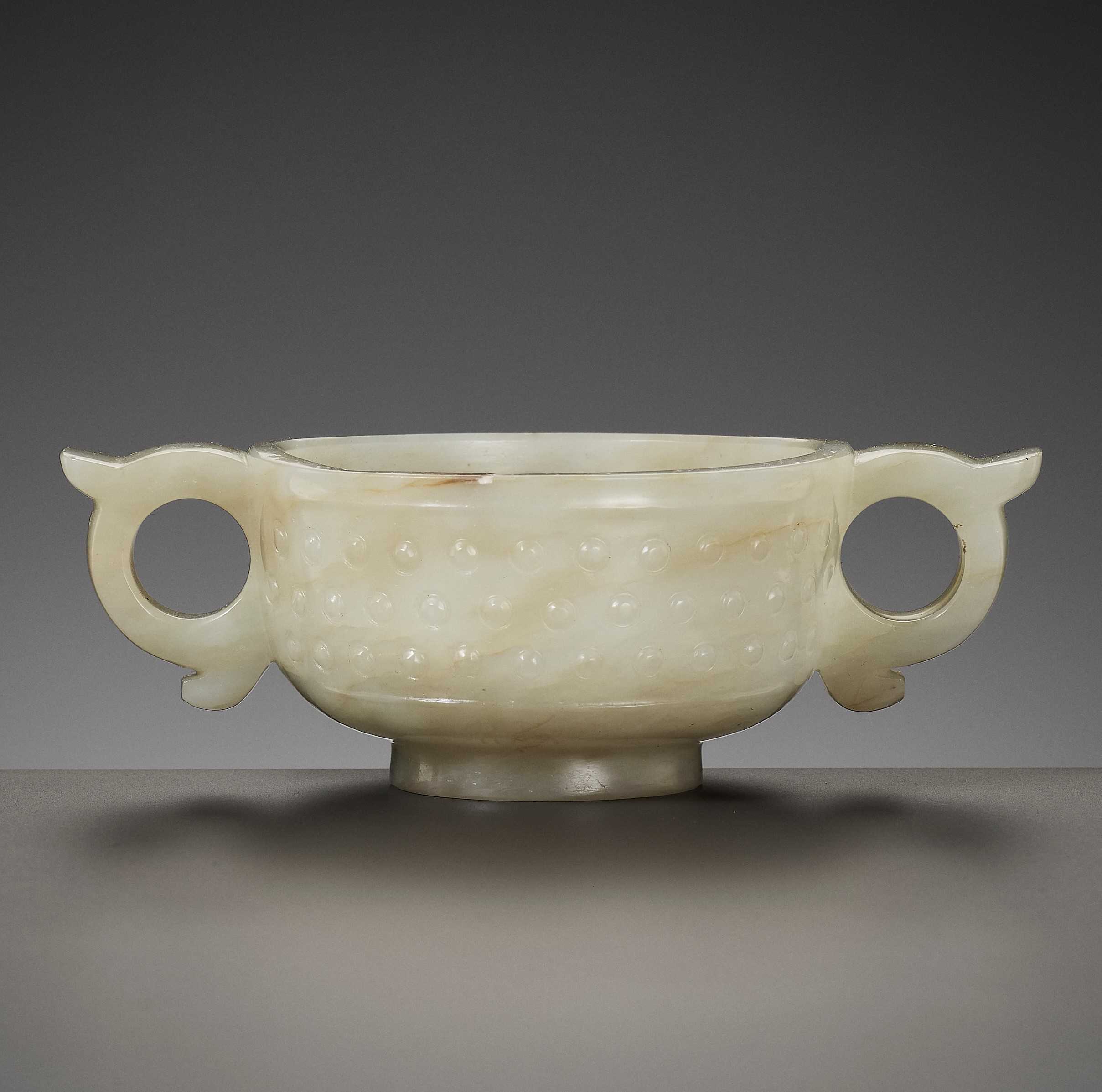 Lot 330 - A PALE CELADON JADE WINE CUP, MING DYNASTY
