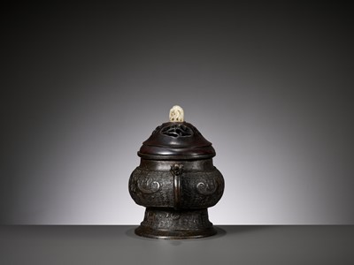 Lot 486 - A BRONZE CENSER, GUI, WITH A WOOD COVER AND A JADE FINIAL, YUAN TO MING DYNASTY