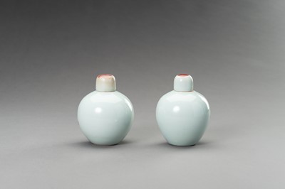 Lot 380 - A RARE PAIR OF COPPER-RED, LIDDED PORCELAIN JARLETS DEPICTING GOATS, 1900s