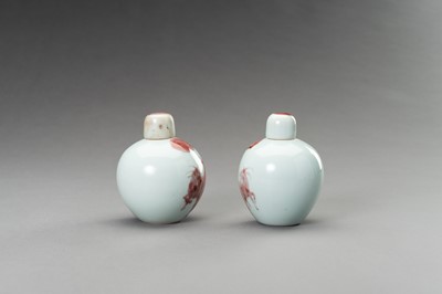 Lot 380 - A RARE PAIR OF COPPER-RED, LIDDED PORCELAIN JARLETS DEPICTING GOATS, 1900s
