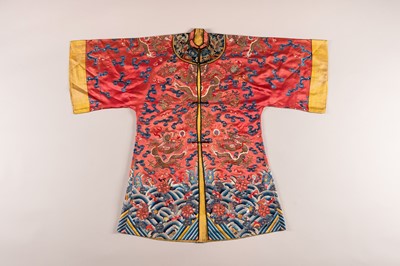 Lot 965 - A RED GROUND EMBROIDERED SILK ROBE, QING