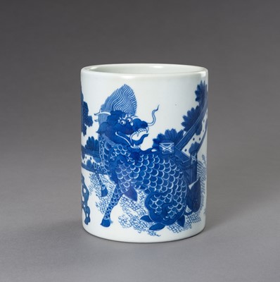 Lot 768 - A BLUE AND WHITE PORCELAIN ‘QILIN’ BRUSHPOT, QING