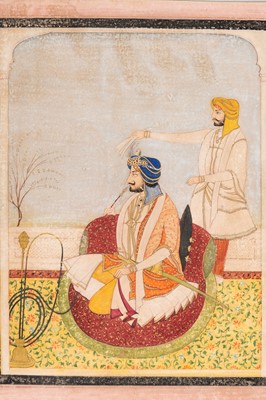 Lot 1323 - AN INDIAN MINIATURE PAINTING OF A RULER SMOKING A HUQQA