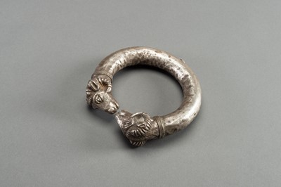 Lot 1361 - AN ACHAEMENID SILVER RAM-HEADED BRACELET