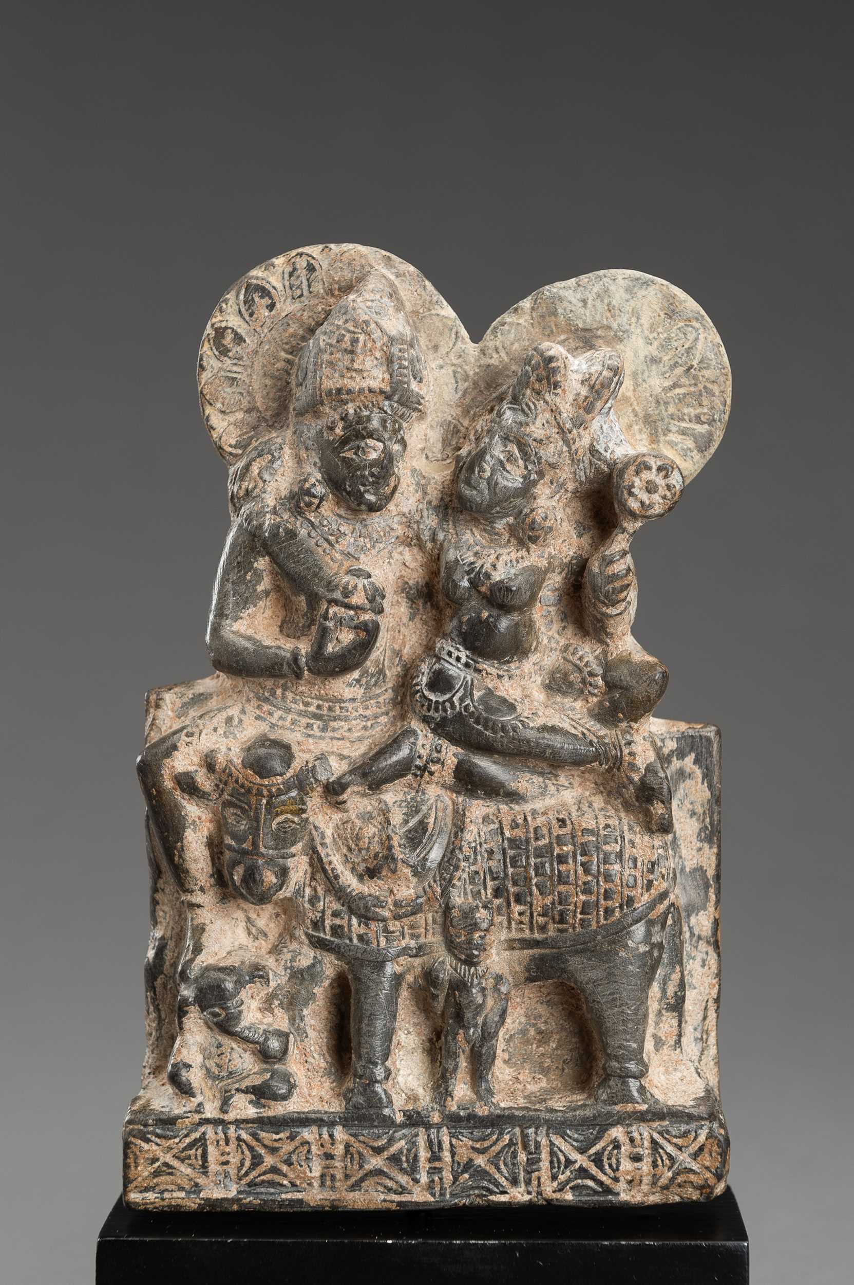 Lot 903 - A GRAY STONE STATUE OF UMA-MAHESHWARA