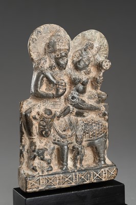 Lot 903 - A GRAY STONE STATUE OF UMA-MAHESHWARA