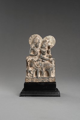 Lot 903 - A GRAY STONE STATUE OF UMA-MAHESHWARA