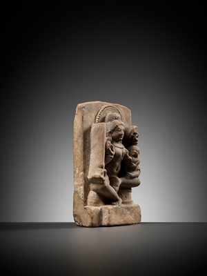 A RARE SANDSTONE MINATURE STELE FIGURE OF A MOTHER GODDESS WITH CHILD