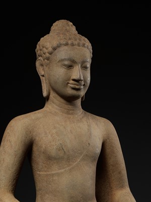 Lot 220 - A MONUMENTAL AND HIGHLY IMPORTANT SANDSTONE FIGURE OF BUDDHA, PRE-ANGKOR PERIOD