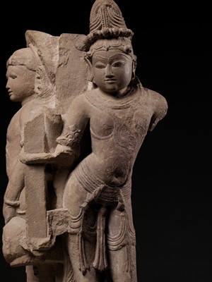 Lot 700 - A PINK SANDSTONE ARCHITECTURAL CORNER ELEMENT WITH TWO MANIFESTATIONS OF SHIVA, CHANDELLA PERIOD