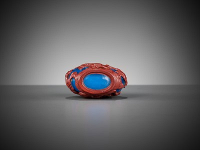 Lot 618 - A CINNABAR-RED OVERLAY BLUE GLASS ‘DRAGON’ SNUFF BOTTLE, 1780-1860