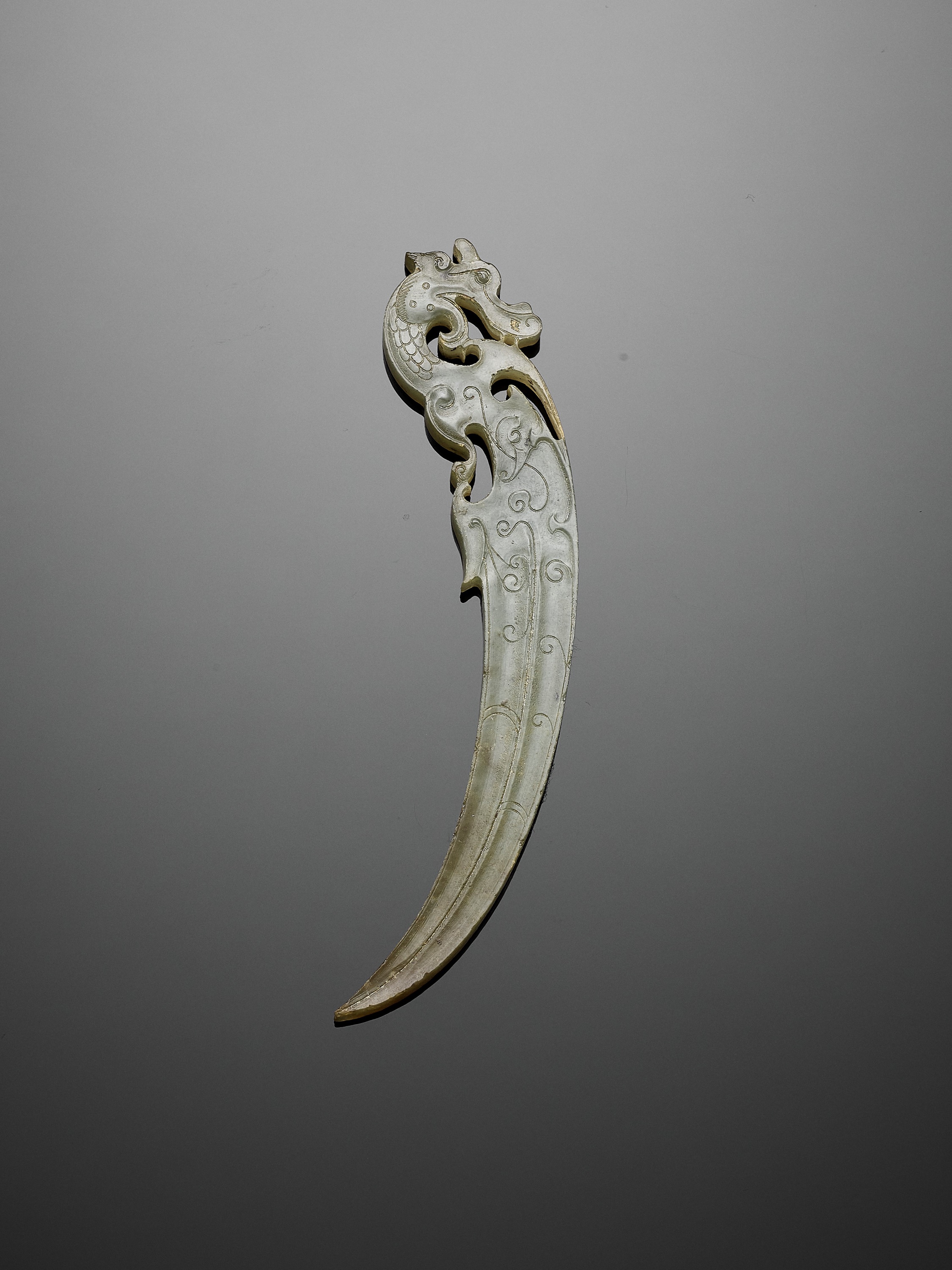 Lot 93 - A JADE 'DRAGON' PENDANT, XI, WARRING STATES