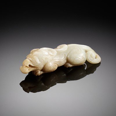 A WHITE AND BROWN JADE FIGURE OF A BIXIE, SIX DYNASTIES