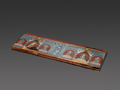Lot 185 - A RARE AND VERY LARGE PAINTED WOOD SUTRA COVER, NEPAL, CIRCA 1450