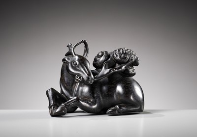 Lot 129 - A ZITAN FIGURE OF A DEER HOLDING LINGZHI, 18TH CENTURY