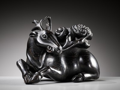 Lot 116 - A ZITAN FIGURE OF A DEER HOLDING LINGZHI, 18TH CENTURY
