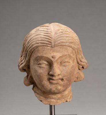 Lot 622 - A TERRACOTTA HEAD OF A FEMALE BODHISATTVA, GANDHARA