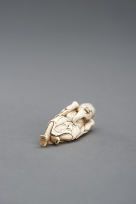 Lot 417 - AN IVORY NETSUKE OF A JOYFUL SENNIN, EDO PERIOD