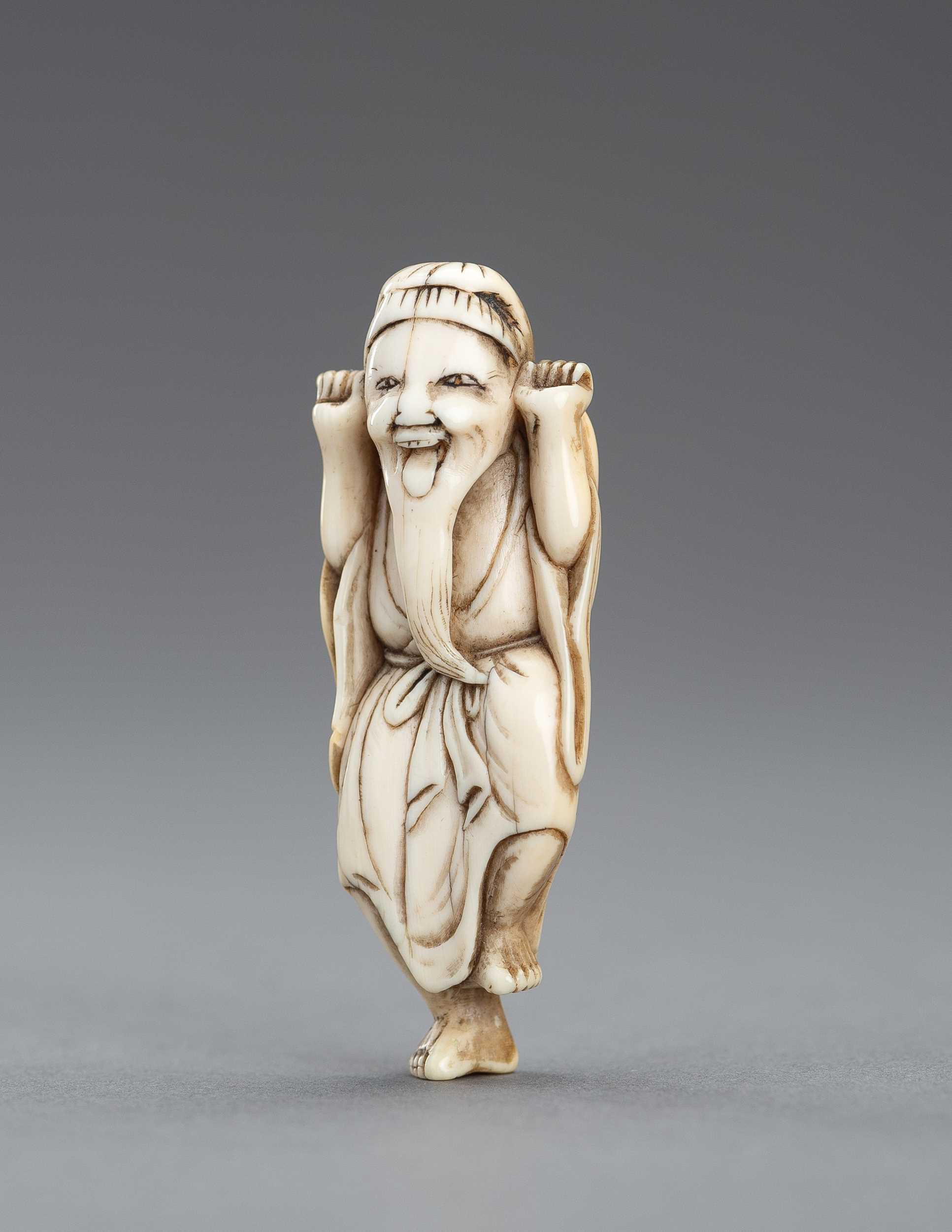 Lot 417 - AN IVORY NETSUKE OF A JOYFUL SENNIN, EDO PERIOD
