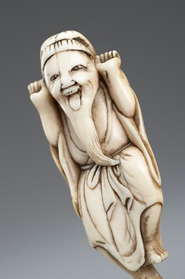 Lot 417 - AN IVORY NETSUKE OF A JOYFUL SENNIN, EDO PERIOD