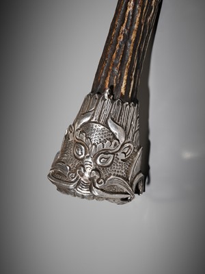 Lot 549 - A SILVER AND STAG ANTLER ‘MAKARA’ FLUTE, KANGLING, TIBET, 19TH CENTURY