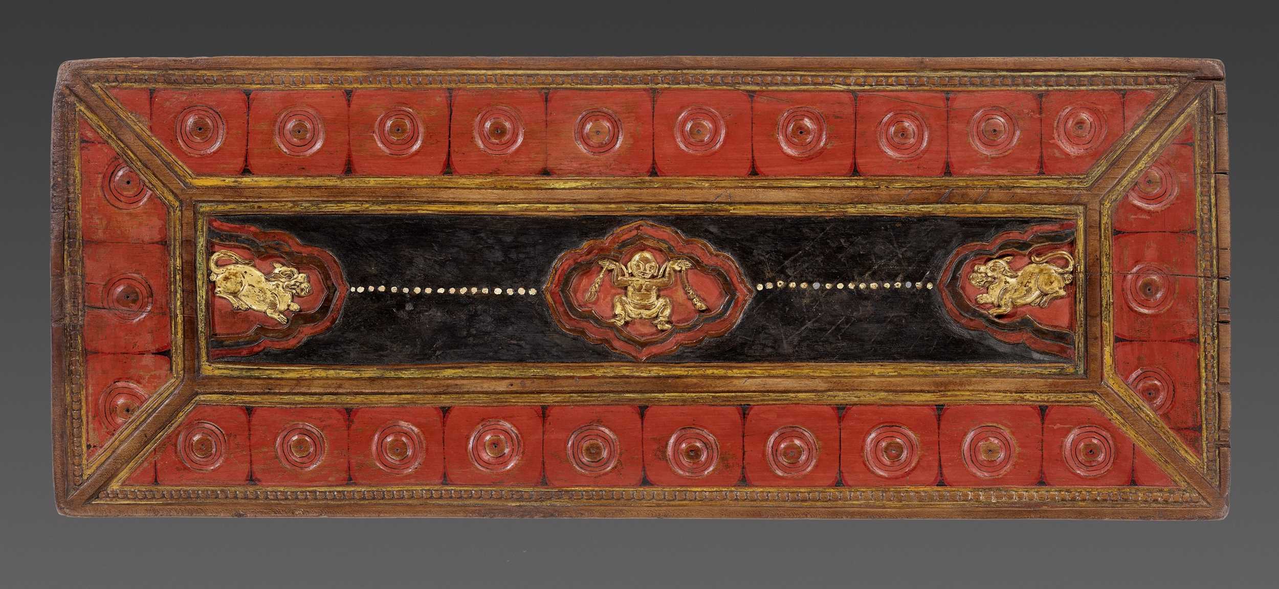 Lot 552 - A PAINTED AND GILT WOOD MANUSCRIPT COVER, TIBET, 14TH-15TH CENTURY