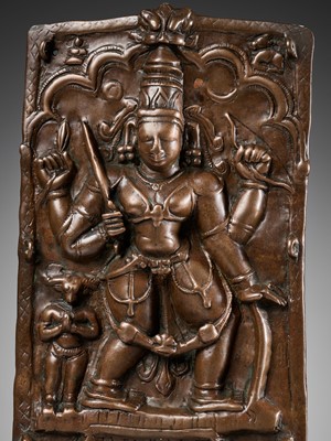 Lot 907 - A CEREMONIAL COPPER SHIELD DEPICTING VIRABHADRA, 17TH-18TH CENTURY