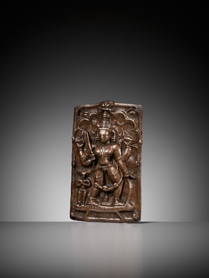 Lot 907 - A CEREMONIAL COPPER SHIELD DEPICTING VIRABHADRA, 17TH-18TH CENTURY