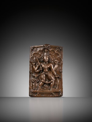 Lot 907 - A CEREMONIAL COPPER SHIELD DEPICTING VIRABHADRA, 17TH-18TH CENTURY