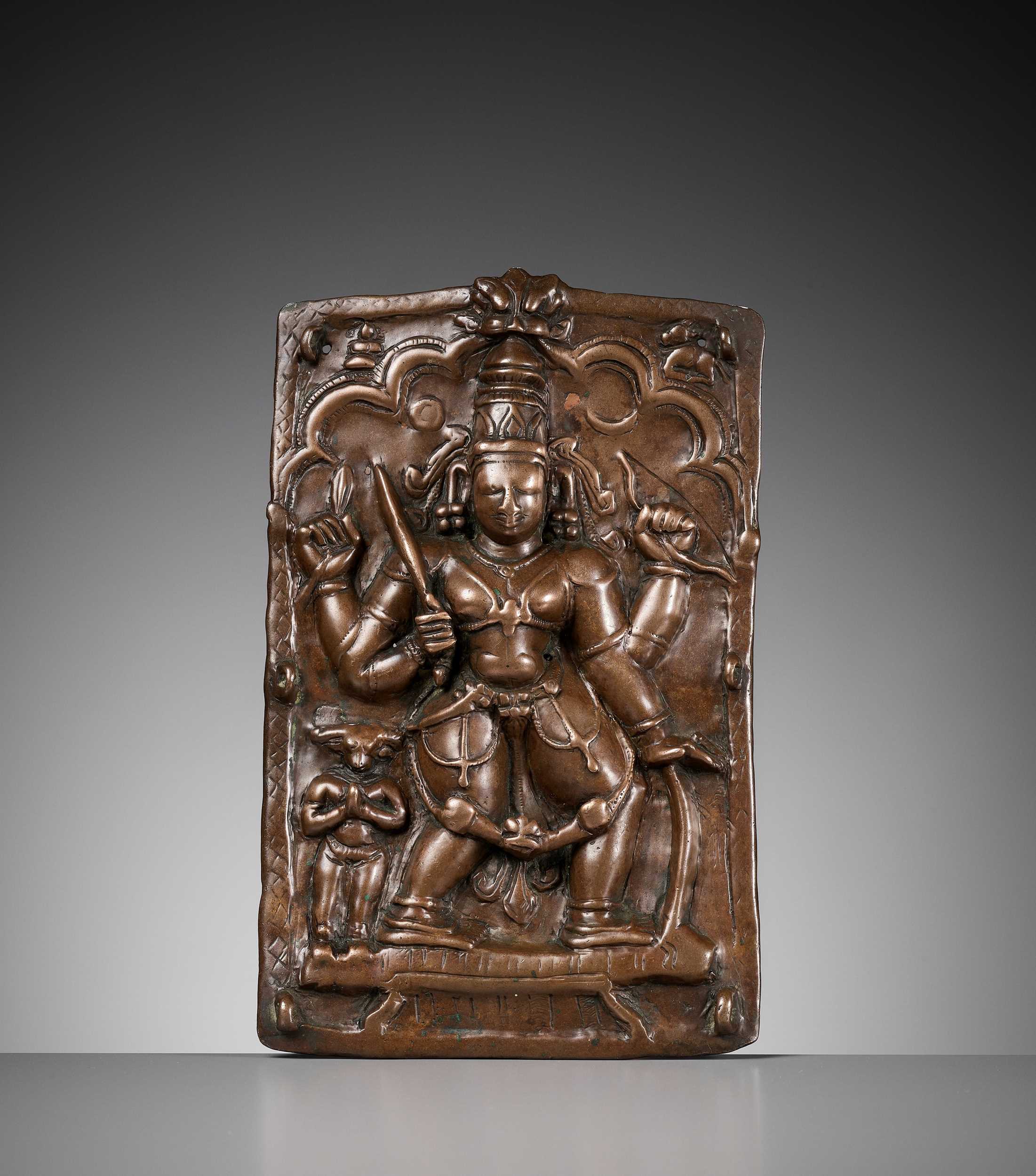 Lot 907 - A CEREMONIAL COPPER SHIELD DEPICTING VIRABHADRA, 17TH-18TH CENTURY